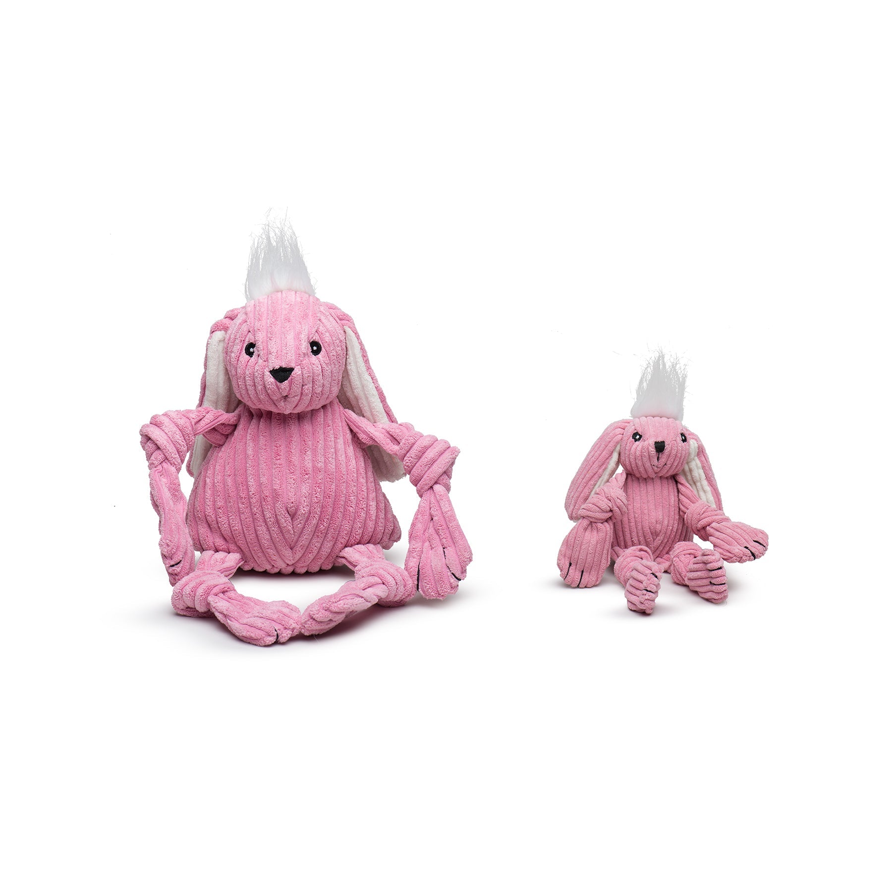 Two pink plush toys with braided tails on a white background