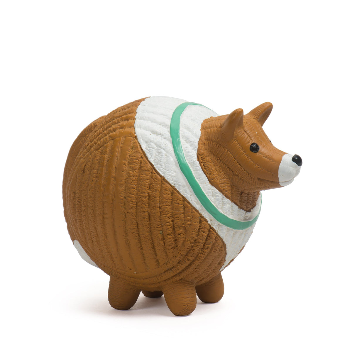 Small dog figurine wearing a sweater on a white background