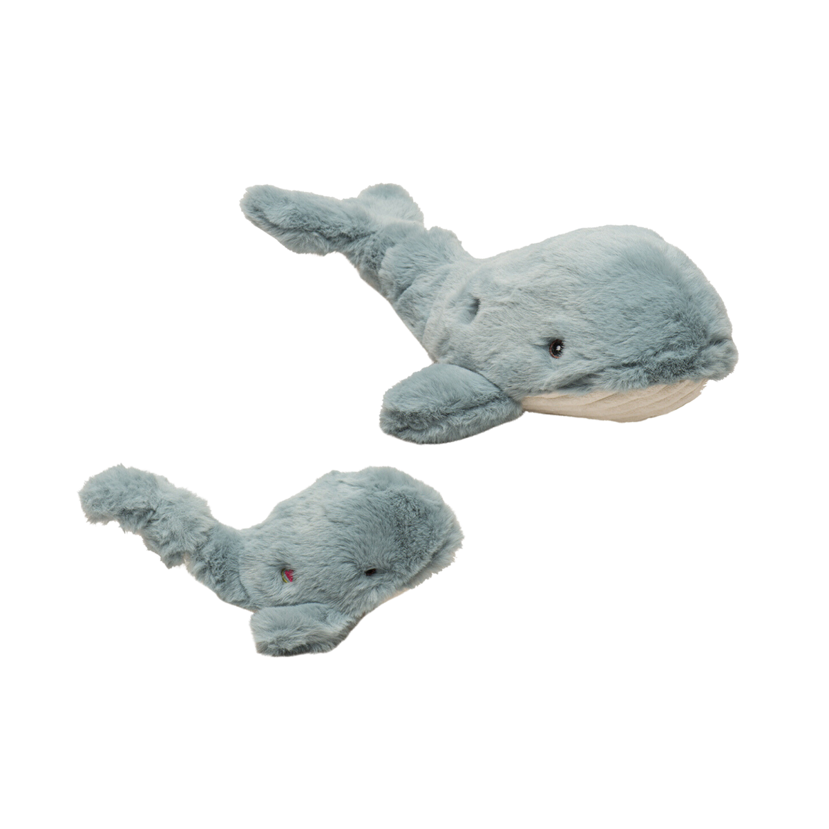 Two plush whale toys on a white background