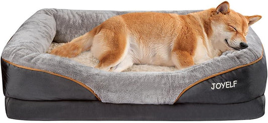 Dog sleeping on a gray and brown pet bed with 'JOYELF' branding.