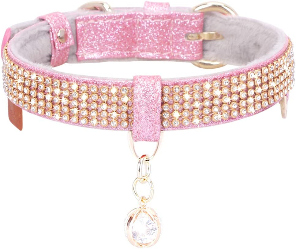 Pink glittery dog collar with rhinestones and a keychain on a white background