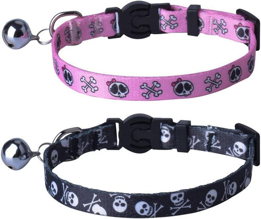 Two cat collars with skull pattern, one pink and one black, on a white background.