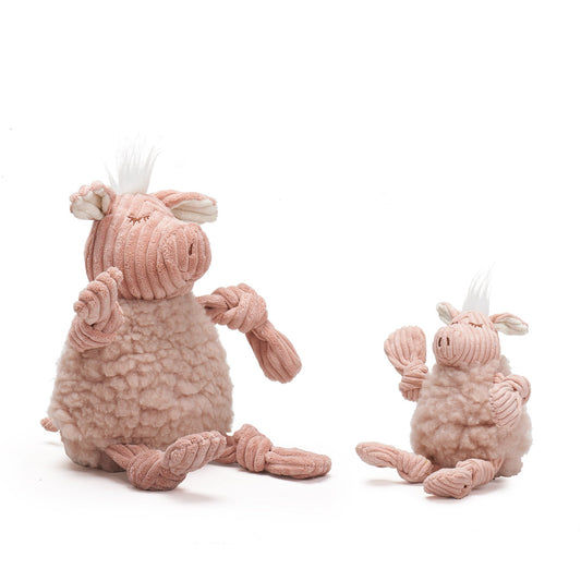 Two pink plush toys with rope handles on a white background
