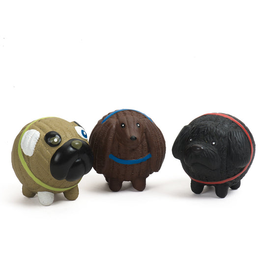 Three dog-shaped toys with different colors and accessories on a white background