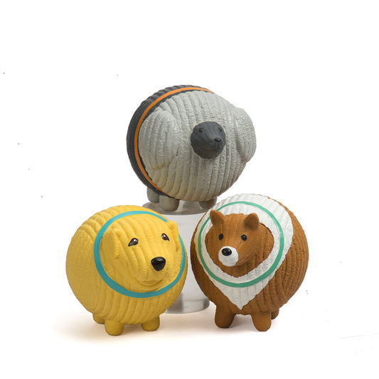 Three dog-shaped figurines with colorful collars on a white background