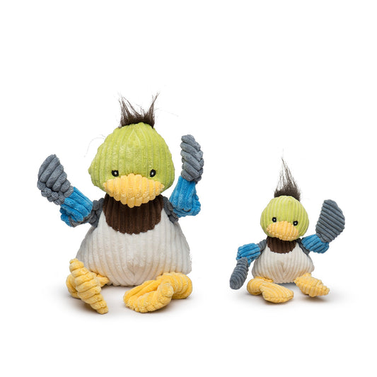 Two knitted penguin toys with green hats and blue mittens on a white background