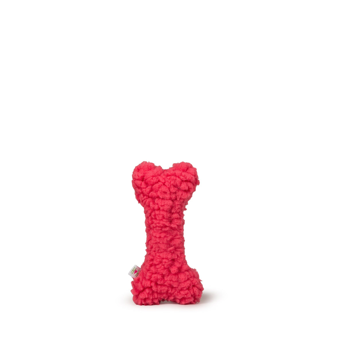 Red textured bone-shaped toy on a white background