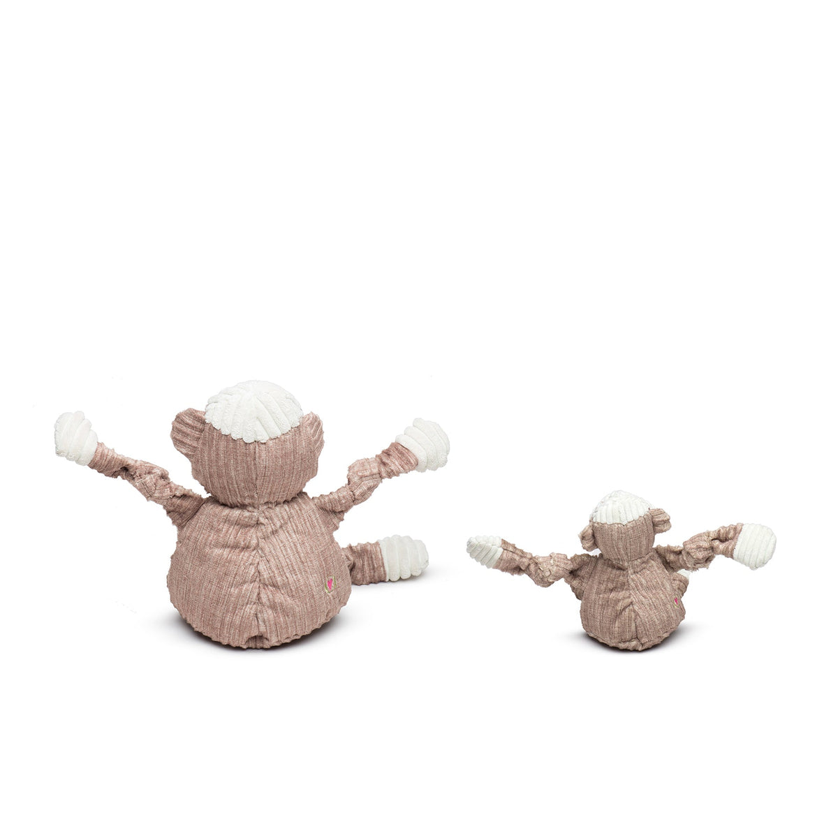 Two plush monkey toys on a white background