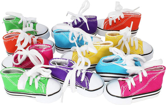 Colorful toy sneakers with white laces on a white background