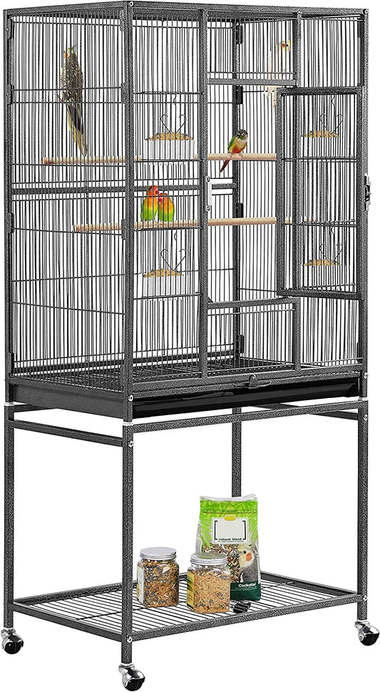 Bird cage with perches and a stand containing bird food on a white background
