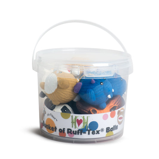 Bucket of Ruff-Tex dog toys with colorful labels on a white background