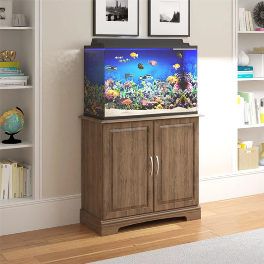 Wooden cabinet with fish tank on top in a room with shelves and decor.