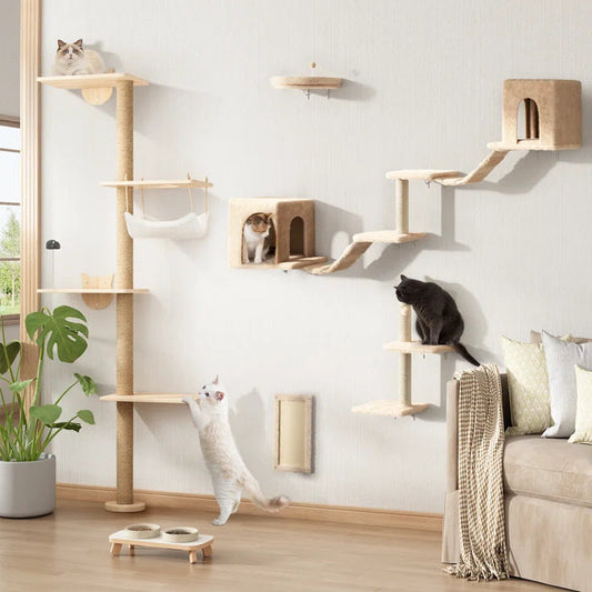 Cat tree with various levels and a cat sitting on one of the platforms in a room.
