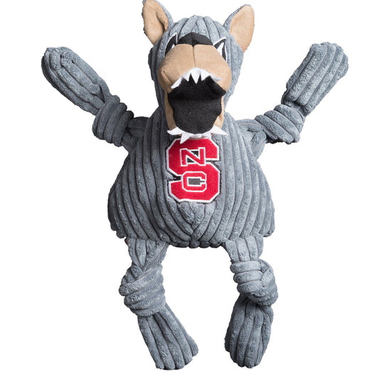 Dog toy resembling a wolf in a gray sweater with a red 'NC' logo on a white background
