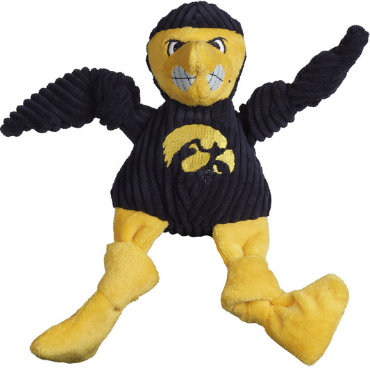 Plush toy resembling a mascot in a black sweater with a yellow logo on a white background