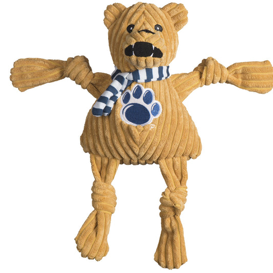 Dog toy resembling a bear with a striped scarf and paw print on a white background