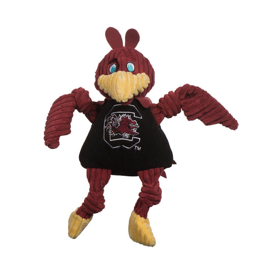 Plush toy with maroon and yellow colors on a white background