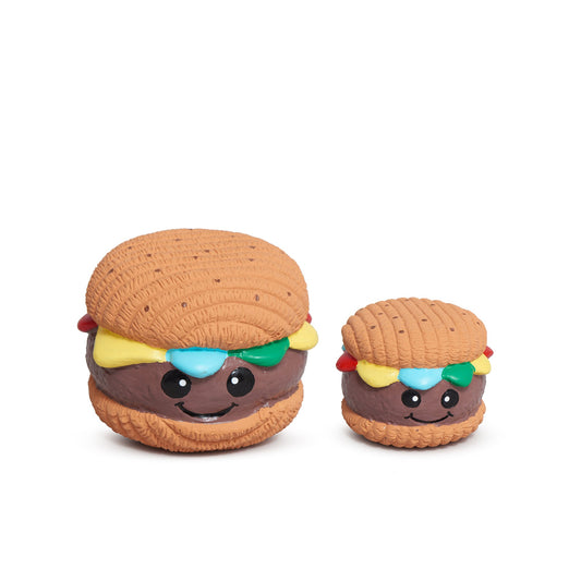 Two toy burgers with smiling faces on a white background