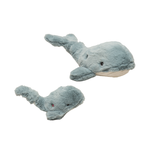 Two plush whale toys on a white background