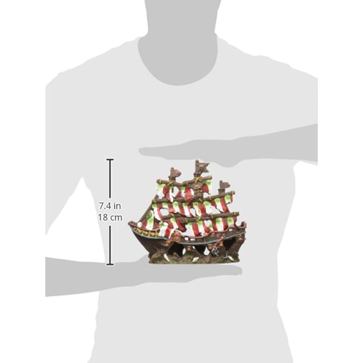 Pirate ship decoration held by a person to show size, with measurements indicated.