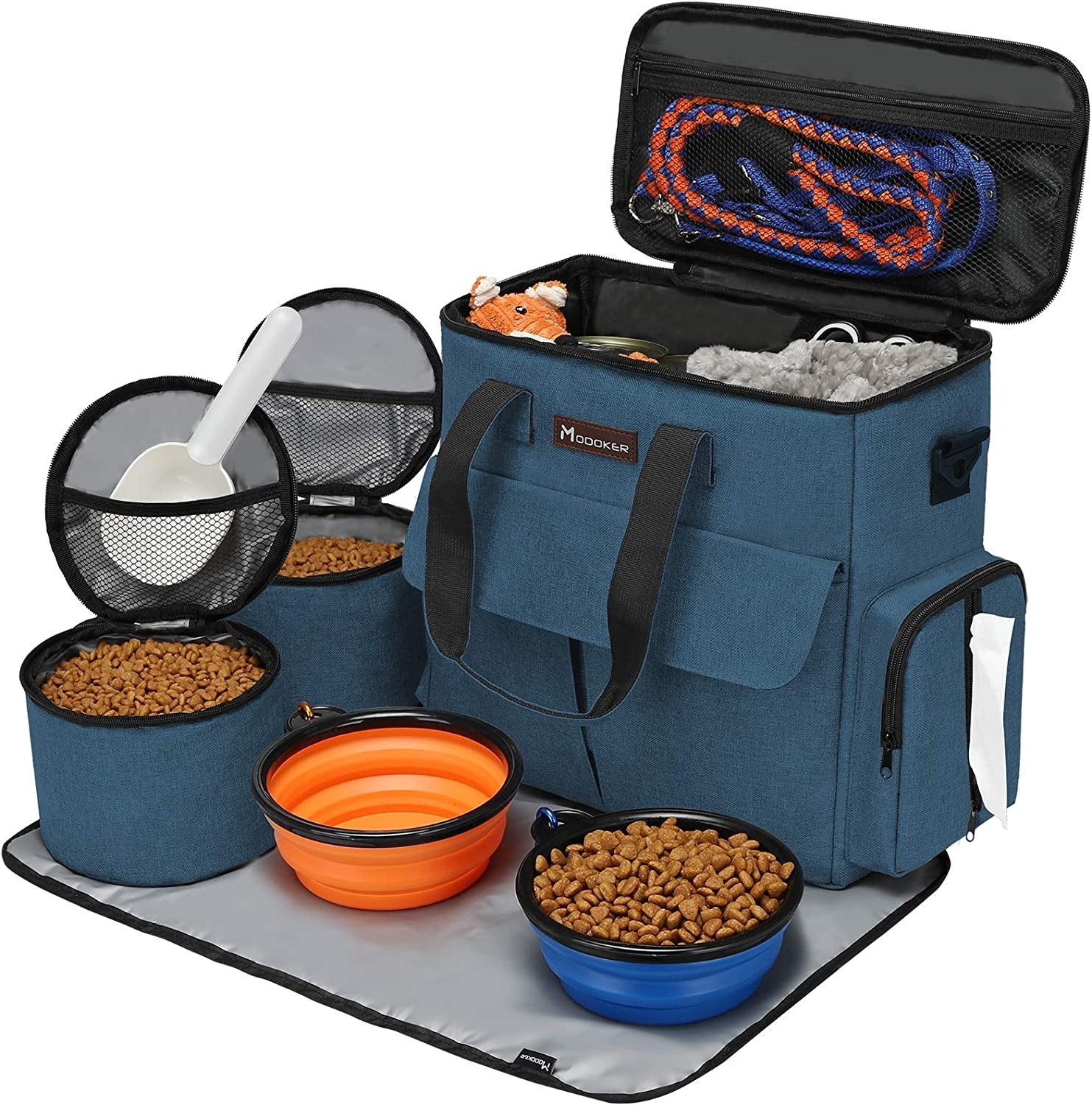 Pet travel bag with food bowls and supplies on a white background
