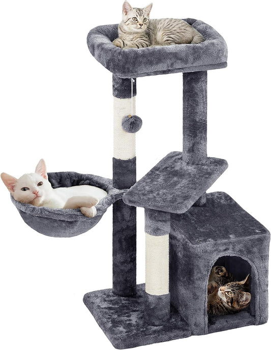Cat tree with multiple levels and a hammock on a white background