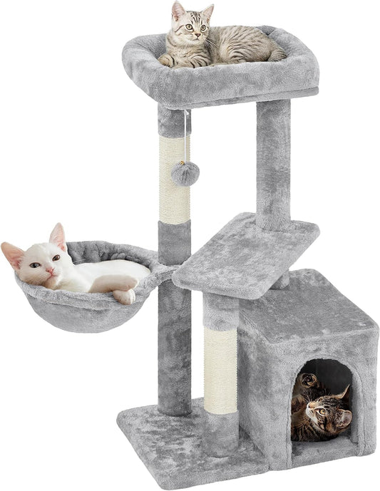 Cat tree with multiple levels and a hammock on a white background