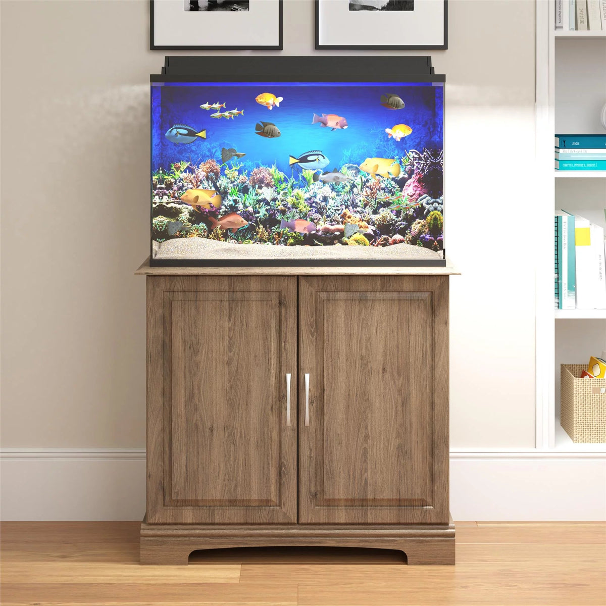 Wooden aquarium stand with a fish tank displaying colorful fish and coral in a room setting.