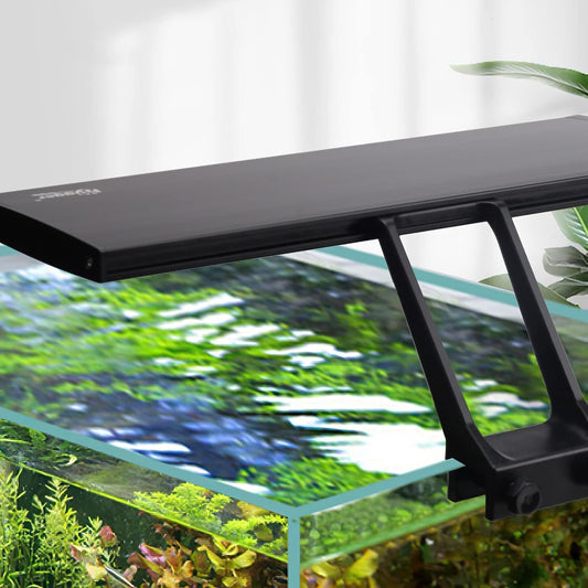 Black aquarium light fixture on a fish tank with green plants