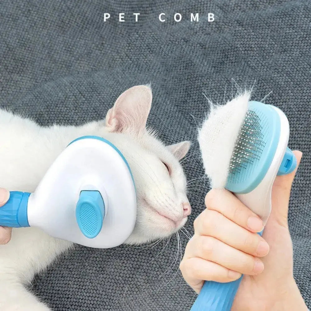Pet comb being used on a white cat with a gray background