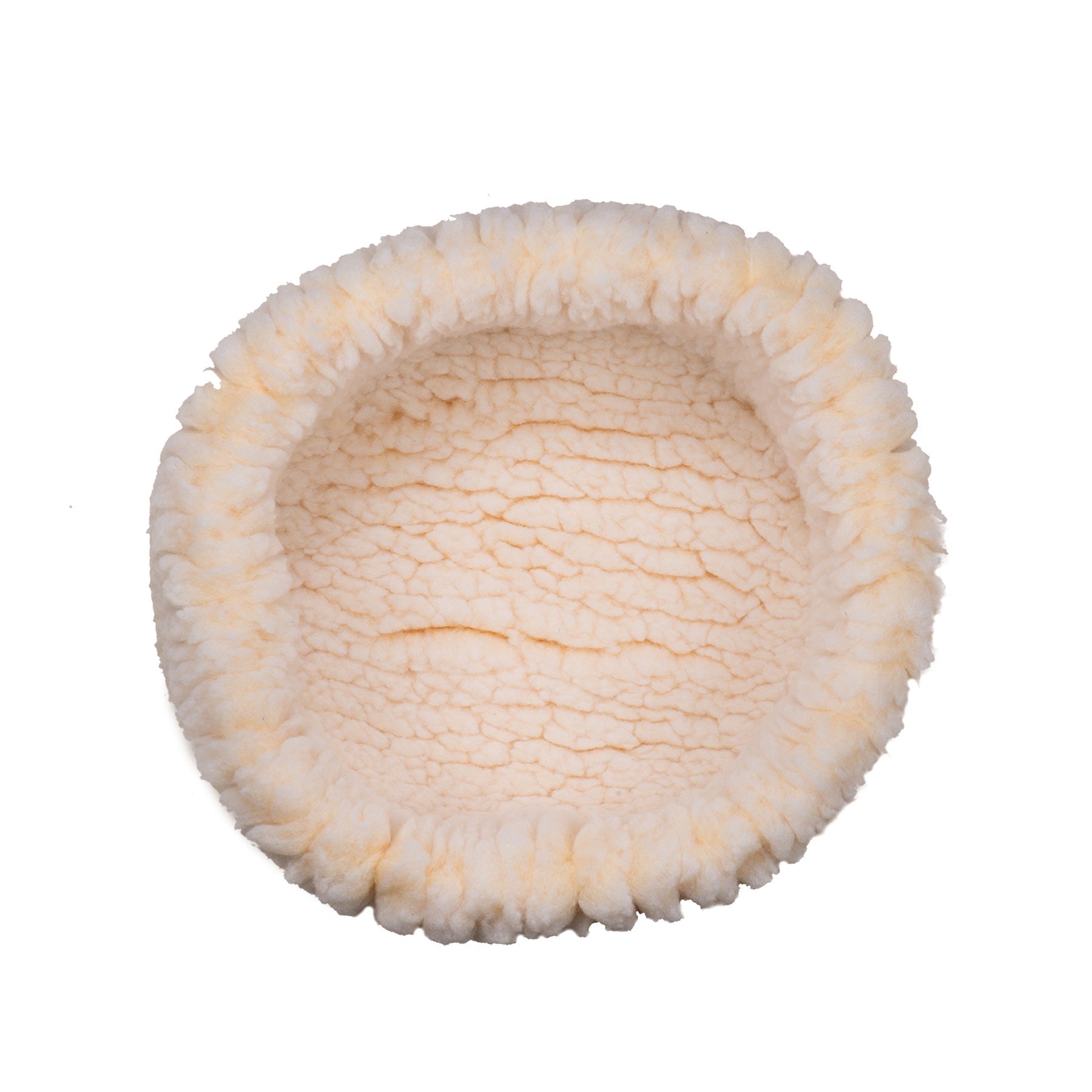 Round, plush pet bed with a textured surface on a white background