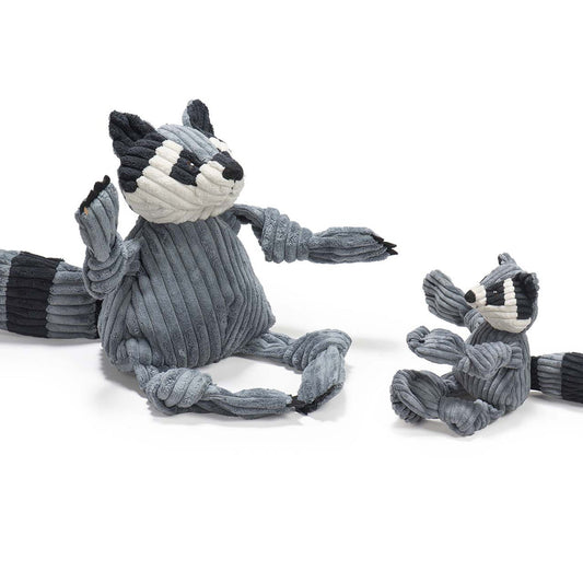 Two gray raccoon-shaped dog toys with black and white accents on a white background