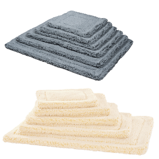 Set of blue and beige towels on a white background