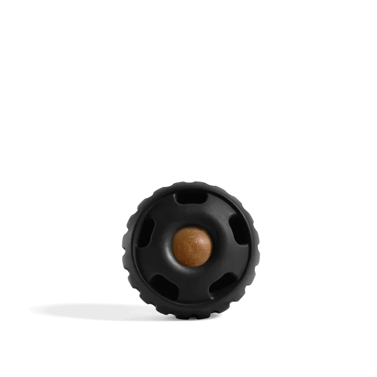 Black textured ball with a brown center on a white background