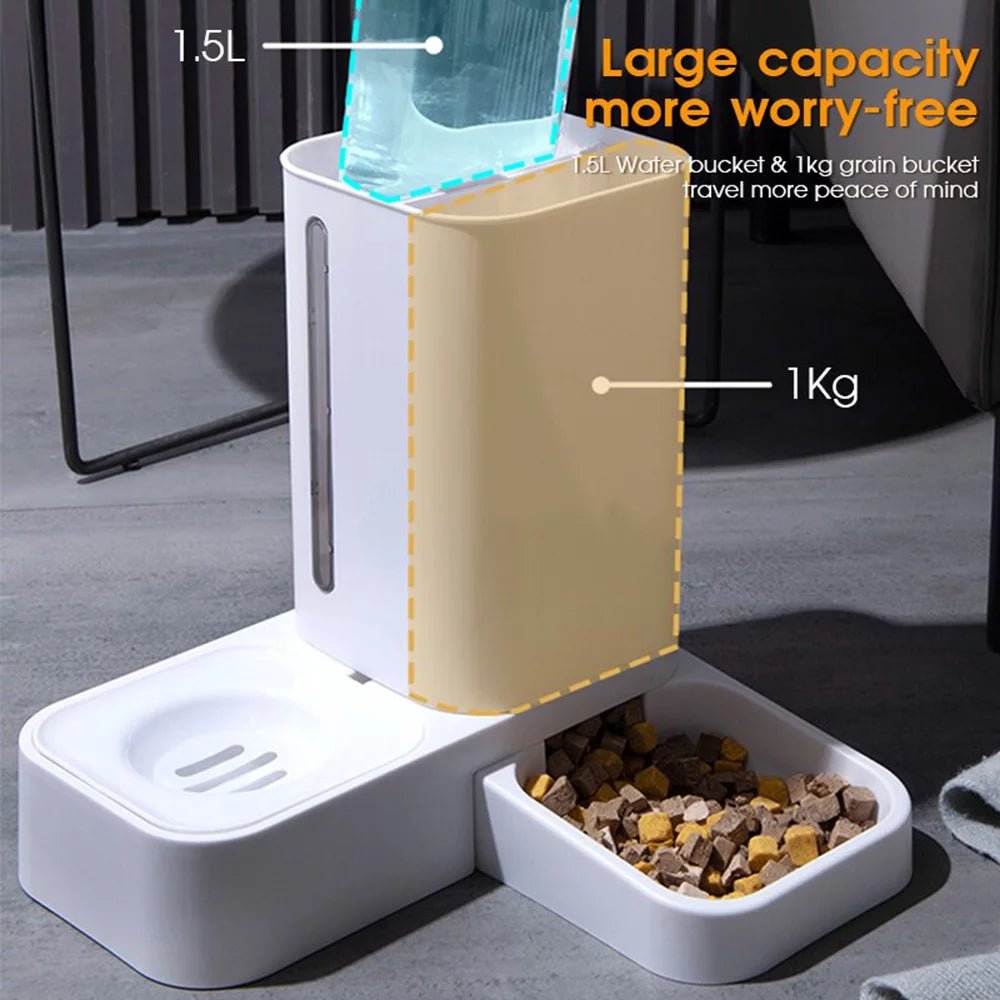 Pet feeder with water and food compartments on a gray surface.