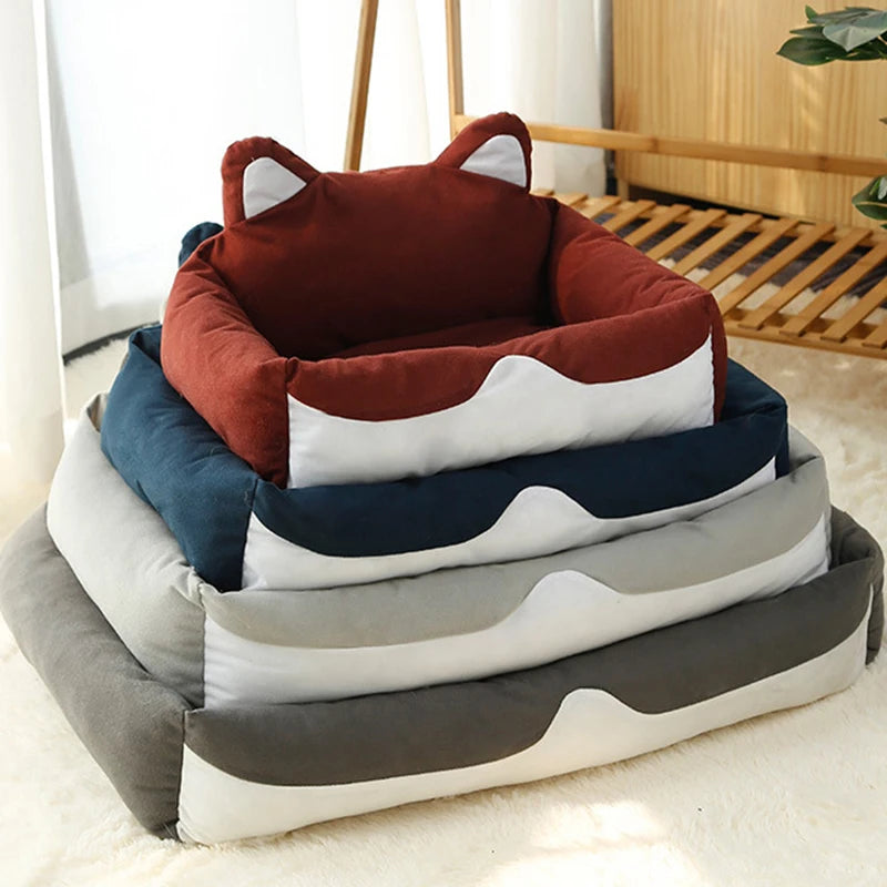 Stack of pet beds with fox design on a light background