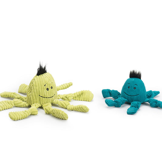 Two toy octopuses, one green and one blue, on a white background