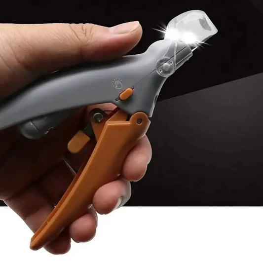 Hand holding a tool with a light on a dark background