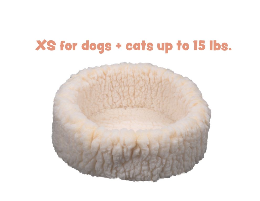 Small fluffy pet bed for dogs and cats up to 15 lbs on a white background